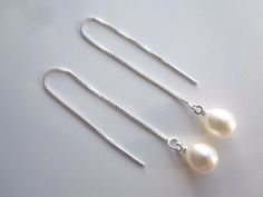 Stunning pair of 925 sterling silver pull through threader pearl earrings.  Approximately  8x9mm white freshwater pearls on a 925 sterling silver box chain supplied with butterfly fastener so you can wear them as an extra long dangle earrings.   The pearls are genuine freshwater pearls therefore each pearl is slightly different in shape and size and each pearls has it own unique natural blemishes.  Will be sent in a gift box The colour of the actual earrings might be slightly different to the ph White Sterling Silver Threader Earrings, Silver Sterling Silver Threader Earrings For Wedding, Elegant Sterling Silver Round Threader Earrings, Classic Silver Threader Earrings As Gift, Elegant Sterling Silver Threader Earrings With Pearl Drop, White Sterling Silver Threader Earrings With Ear Wire, Classic White Threader Earrings As Gift, White Pearl Drop Threader Earrings, Sterling Silver White Threader Earrings