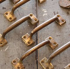 several metal handles and latches on a door