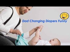 a man holding a baby in his lap with the words dad changing diapers funny