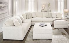 a large white sectional couch in a living room