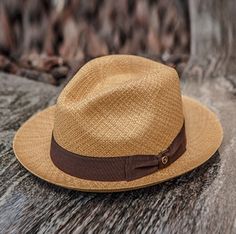 Similar to the Black Bow Band on White Panama Hat also from the Austral Hats line, this hat has a short brim and tear drop style crown accented in a bowed band. This hat comes with a brown band and cafe tan colored genuine panama straw hand woven from 100% Toquilla straw. *Stylish, lightweight, and comfortable. *Snap Brim - Turn up or down for your own style Mens Summer Hats, Mens Straw Hats, Mens Dress Hats, Trending Hats, Outback Hat, Mens Hats Fashion, Bow Flats, Western Hats, Hat Band