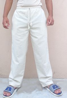 These are casual linen trousers. Features: ★ Material: Upto 80% Linen +Upto 20% cotton ★ Select your size by clicking on the 2nd picture ★ A high quality fabric(quality weaving) ★ A high quality stitching ★ Simultanously elasticated and draw string fitted waist ★ High quality weaving and very strong fabric ★ Has 2 side pockets and 2 hip pockets ★ Pre-washed fabric ★Colour: Cream Linen comes from flax plants and are biodegradable. Flax plants do not require as much water and pesticides as cotton plants, therefore they are considered more sustainable and environment friendly than cotton. Full Length Cotton Bottoms For Vacation, Relaxed Cotton Pants For Summer, White Cotton Pants For The Beach, White Cotton Pants For Beach, Relaxed Solid Cotton Pants, Relaxed Solid Color Cotton Pants, Relaxed Cotton Pants In Solid Color, Relaxed Fit Cotton Pants For Vacation, Relaxed Cotton Pants For Vacation