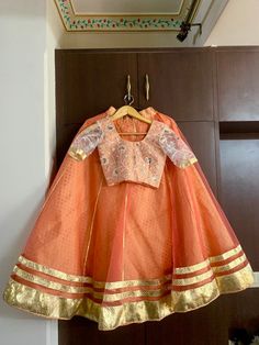 Custom made beautifull costume with double layers skirt of brocade and net. It comes with golden tassels, dupatta of your choice and blouse  Discuss with our designers about your dancing dress . Negotiation on price as per quantity.  - The first layer is banarasi brocade - the top layer is fine quality net  - full circle skirt with flare 7.5 meters  - when the dancer will spin the skirt takes full circle - get your outfit custom made with us  - leave a message to discuss - the item will be made as per your measurements  - can be created in any color Bollywood dance costume- Kalbelia dance costume- Indian dance - Pakistani dance - wedding costume - dance - ghoomar - Tera tali dance Orange Chanderi Lehenga With Cutdana, Traditional Orange Organza Choli, Bollywood Style Orange Organza Choli, Anarkali Orange Organza Lehenga, Fitted Peach Traditional Wear With Zari Work, Orange Chanderi Choli For Wedding, Orange Anarkali Lehenga In Organza, Orange Anarkali Organza Sets, Festive Orange Organza Choli