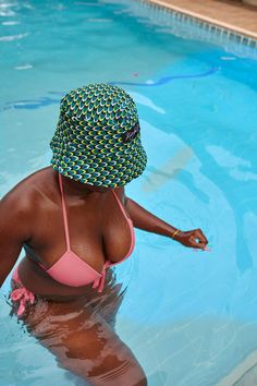 This unisex bucket hat features a fun, vibrant pattern that is also reversible, making it a versatile and stylish accessory. The one size fits most design ensures a secure and comfortable fit for both men and women. Handmade in Ghana Size: 24 inches in diameter Print: Effie and Awusi Trendy Bucket Sun Hat For Pool, Reversible Bucket Hat For Vacation, Green Reversible Bucket Hat With Curved Brim, Green Reversible Curved Brim Bucket Hat, Fun Multicolor Reversible Hats, Reversible Green Sun Hat For The Beach, Green Reversible Bucket Hat, Trendy Reversible Multicolor Sun Hat, Playful Reversible Bucket Hat With Curved Brim