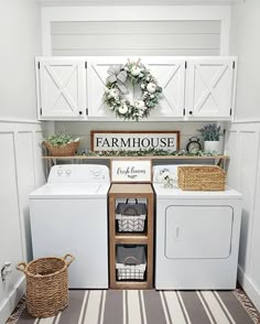 a white washer and dryer sitting next to each other in a laundry room