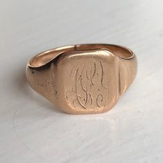 A vintage 9 carat rose gold signet ring.  CONDITION: Wear consistent with age and use. Please see photos for more detail. HALLMARKED 9 CARAT GOLD BAND WIDTH (SMALLEST PART): 3.5mm FACE SIZE: 11mm x 11mm RING SIZE: UK: P | US: 7 3/4 WEIGHT: 4.8g (UDZ)