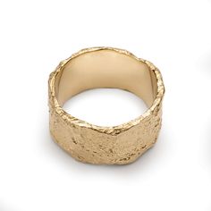 a gold ring on a white background