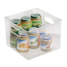 a clear container filled with lots of different types of jams and condiments