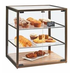 a bakery display case filled with lots of pastries