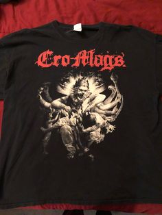 a black shirt with an image of a demon on it