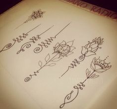 a sheet of paper with writing on it and flowers drawn on the top of it