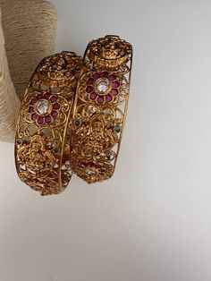 Traditional Bangles comes as a PairColor : Matte GoldSize : Size : 2.4Stones : AD Red Green Stones Antique Necklace Victorian, Traditional Bangles, Kada Bangles, Rani Haar, Real Pearl Necklace, Ethnic Necklaces, Traditional Earrings, Green Stones, Goddess Lakshmi