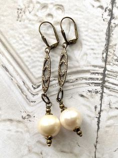 Art Nouveau Large Freshwater Pearl Drop Dangle Long Earrings Vintage Handmade Teardrop Pearl Earrings, Elegant Nickel-free Brass Pearl Earrings, Elegant Antique Gold Earrings With Lever Back Ear Wires, Antique Dangle Pearl Drop Earrings, Antique Style Dangle Pearl Drop Earrings, Antique Pearl Drop Dangle Earrings, Gold Vintage Pearl Earrings Nickel Free, Vintage Brass Pearl Drop Earrings, Vintage Dangle Pearl Earrings With Ear Wire