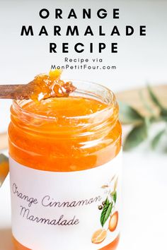 an orange marmalade recipe in a jar with a spoon on the side and text overlay that reads orange marmalade recipe