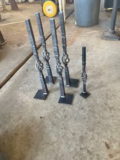 four metal poles are standing on the ground