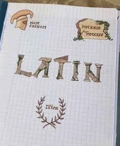 an open notebook with the word latin written in different font styles and designs on it