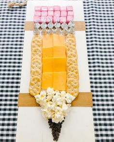 a cheese and cracker appetizer is displayed on a table