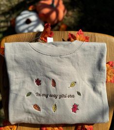 Discover the perfect blend of comfort and style with our embroidered clothing. All of my products are made to order, by me, at home in my little mini studio! I am committed to ensuring every item is top quality, long lasting and made with care. Embrace the essence of fall with our cosy Autumn Leaves Sweatshirt. Crafted from the softest blend of cotton and polyester, this sweatshirt promises comfort and warmth as the temperatures drop. The design features a stunning array of autumn leaves in rich Cute Custom Embroidered Tops For Fall, Cute Tops With Custom Embroidery For Fall, Cozy Cotton Sweatshirt With Embroidered Text, Cute Cotton Sweatshirt With Custom Embroidery, Fall Cotton Sweatshirt With Floral Embroidery, Cute Floral Embroidered Sweater For Fall, Cute Floral Embroidery Sweater For Fall, Cute Embroidered Sweatshirt For Fall, Cute Embroidered Text Tops For Fall