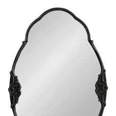 an ornate mirror is shown against a white background