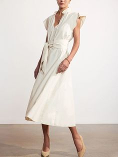 Brochu Walker - $348.00 | A special new addition to our sought-after dress collection, our Newport Midi Dress is the epitome of easy femininity. A richly detailed, panel seamed body with godets, a notched vee, ruffled neckline and pintuck pleats at the shoulder that culminate into a sleeveless ruffle define this midi dress, while signature Brochu Walker details like a self, removable belt add versatility. #brochuwalker #springfashion #AD Spring V-neck Dresses With Belted Cuffs, Chic Belted A-line Sleeveless Dress, Chic Midi Dress With Pleated Waist And Flutter Sleeves, Fitted Belted Dress With Flutter Sleeves, Chic Belted Midi V-neck Dress, Chic Belted V-neck Midi Dress, Chic Midi Dress With Flutter Sleeves For Work, Chic Flutter Sleeve Midi Dress For Work, Chic Workwear Midi Dress With Flutter Sleeves