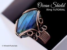 the ring is made from wire and has a blue stone in it's center