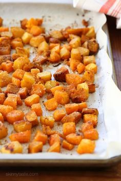 some food that is sitting on a white plate and ready to be cooked in the oven