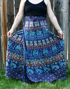 "This is the kind of thing that makes me say \"It's fabulous!\" - hence the name of my shop. A gorgeous Indian cotton block print maxi wrap skirt from the 1970s, in beautiful tones of navy blue, turquoise, dark mustard, and off-white. Lines of camels, elephants, and peacocks march around the skirt, alternating with bands of elaborate floral designs. Closes with two waist ties. Sits high on the waist and falls to floor length. Note this is not cotton gauze, but a medium-weight cotton fabric. Size Blue Cotton Hippie Skirt, Blue Cotton Maxi Skirt, Blue Bohemian Maxi Length Bottoms, Bohemian Blue Maxi Bottoms, Bohemian Blue Maxi Length Bottoms, Traditional Blue Cotton Skirt, Blue Hippie Long Skirt, Hippie Blue Long Skirt, Blue Long Skirt For Festival