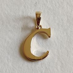 This is an exquisite initial charm pendant set in 14K Solid Gold.  An elegant design, perfect for any occassion. ITEM DETAILS: ✓ Letter : C ✓ Gold Kt: Solid 14K Yellow Gold ✓ 14 K Gold Weight : 1.17 grams ✓ Gross Weight: 1.17 grams >>The Gold purity is guaranteed and it comes with authentic 14K gold hallmark. >>A-Z letters available on my Etsy Shop. CUSTOMER SUPPORT: We are available 24/7 to respond to all your queries! PACKAGING: The pendant comes in layers of safe and secure wrapping along with a free Handmade Jewelry Box. Gold Classic Initial Necklace With Charms, Elegant Hallmarked Initial Necklace For Anniversary, Classic Gold Initial Necklace For Formal Occasions, Classic Formal Initial Necklace, Classic Initial Pendant Necklace With Charms, Elegant Hallmarked Initial Pendant Necklace, Elegant Round Initial Necklace, Elegant Hallmarked Initial Necklace, Yellow Gold Initial Necklace With Polished Finish