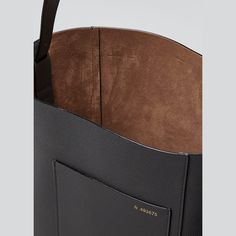 Valextra leather bucket tote bag. Adjustable shoulder strap. Open top. Exterior, front slip pocket. 12.2"H x 9.1"W x 5.9"D. Made in Italy. Bucket Tote Bag, Bucket Tote, Leather Bucket, Open Top, Bergdorf Goodman, Shoulder Strap, Tops Designs, In Italy, Exterior