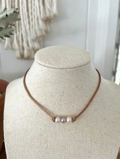 "Materials: Leather Cord and Fresh Water Pearl. Size:Leather cord Length : About 14\"-16\" Size of Pearl: 6-7mm We use gemstones, fresh water pearls, corals, shells, etc. for our creations. This may result in slight variation in shape, size, or colors from the pictures. We really appreciate for your understanding.  If you have any questions, please message me without hesitations. Thank you for visiting our shop. Aloha Hiz" Minimalist Leather Jewelry With Adjustable Cord, Brown Leather Necklace With Adjustable Length, Adjustable Leather Necklaces For Everyday, Adjustable Leather Necklace For Everyday, Minimalist Adjustable Leather Necklace, Adjustable Minimalist Leather Necklace, Brown Waxed Cord Jewelry For Everyday Use, Everyday Waxed Cord Brown Jewelry, Minimalist Everyday Leather Necklace