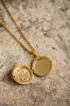 Our Lyon Locket is filled with memories and opens up to hold a picture of a loved one. PRODUCT DETAILS 18K Gold Plated Stainless Steel locket opens up Nickel free chain length: 50cm (19.5") pendant size: 2.8cm (1") CARE For the longest shine avoid contact with water, perfume, moisturizer and hairspray. We recommend you remove your jewelry when showering, exercising, at the beach, or swimming in chlorinated water. All pieces featuring natural gemstones are very precious and need to be treated wit Gold Plated Tarnish Resistant Pendant Locket Necklace, Gold Plated Tarnish Resistant Locket Pendant Necklace, Gold Plated Tarnish Resistant Locket Necklace, Gold-plated Pendant Locket Charm Necklace, Gold-plated Medallion Locket Necklace Gift, Gold Tarnish-resistant Locket Necklace Gift, Gold-plated Locket Pendant Charm Necklace, Amulet Style Round Pendant Locket Jewelry, Spiritual Gold Plated Locket Jewelry