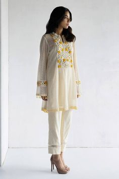 Beige A-line kurta featuring floral embroidery with flared sleeves. Paired with a crochet pant. - Aza Fashions Summer Palazzo Set With Intricate Embroidery And Straight Kurta, Summer Festive Palazzo Set With Intricate Embroidery, Bohemian Fitted Salwar Kameez With Sheer Dupatta, Summer Festive Kurta With Sheer Dupatta, Designer Spring Kurta With Sheer Dupatta, Designer Kurta With Sheer Dupatta For Spring, Bollywood Style Spring Chikankari Embroidery Palazzo Set, Designer Wear Summer Palazzo Set With Resham Embroidery, Bollywood Style Chikankari Embroidery Palazzo Set For Spring