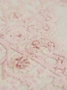 closeup of pink and white embroidered fabric