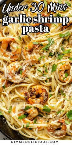 pasta with shrimp and parmesan cheese in a skillet text reads under 30 ways garlic shrimp pasta