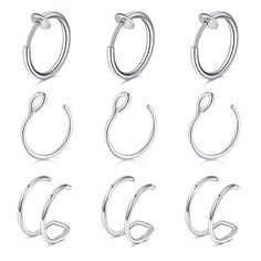 six pairs of hoops with different shapes and sizes, all in stainless steel or white gold