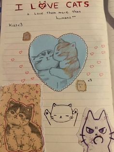 an open notebook with pictures of cats and hearts