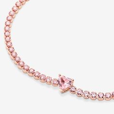 Bring elegance to your outfit with the Sparkling Pavé Tennis Bracelet. Hand-finished in our 14k rose gold-plated unique metal blend, this tennis bracelet is decorated with sparkling orchid pink man-made crystals. A large central heart-shaped stone punctuates a row of evenly sized pavé. The bracelet includes a lobster clasp for safe closure and can be adjusted to three lengths. Style it with other shimmering Pandora Timeless pieces for a classic look that stands out. - Pandora Sparkling Heart Tennis Bracelet - 14k Rose gold-plated unique metal blend / Man-made crystal / Pink - Sz. 6.3 in Heart Tennis Bracelet, Pink Man, Angel Bracelet, Bracelet Tennis, Bracelet Pandora, Pink Men, Argentium Silver, Pandora Bracelets, Style Classique