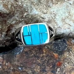 This beautiful Sterling Silver Ring, as part of the Arizona Blue Collection features Kingman Turquoise. Stone Setting: 1/2" x 5/8" The ring is designed by David Rosales, one of the finest contemporary Southwest Artists in the world. He is the founder and co-owner of Supersmiths, Inc. of Gallup, NM. Each ring is custom made and carries a lifetime guarantee. Modernist Blue Gemstone Jewelry, Modernist Blue Jewelry With Polished Finish, Blue Modernist Jewelry With Polished Finish, Modern Polished Turquoise Jewelry, Modern Turquoise Jewelry With Polished Finish, Modern Blue Gemstone Rings, Modern Turquoise Sterling Silver Jewelry, Turquoise Rings With Polished Finish For Anniversary, Modern Silver Ring With Inlay