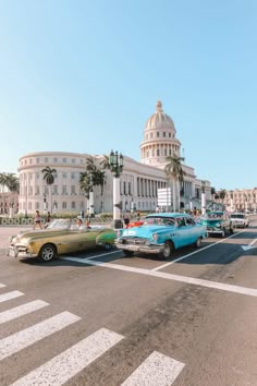 classic cars are parked in front of the capitol building