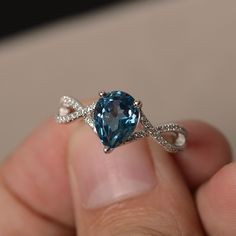 This is a gorgeous handmade creation. Its beauty is its simplicity & Elegance. The 7*9 mm pear shape faceted London Blue Topaz is crafted in solid sterling silver and with rhodium plated. All item is sent in a beautiful gift box If you have any idea of design your ring,pls contact me directly. You can realize more lovely stuff clicking the link https://www.etsy.com/shop/knightjewelry?refshopsection_shophome_leftnav Please leave the correct address and you phone number for delivering successf Cheap Blue Round Midi Rings, Topaz Rings, Blue Gemstone Ring, Blue Gemstone Rings, Cute Engagement Rings, London Blue Topaz Ring, Magical Jewelry, Birthday Ring, Ring Collection