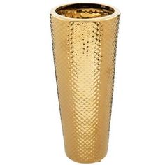 a gold colored vase sitting on top of a white table