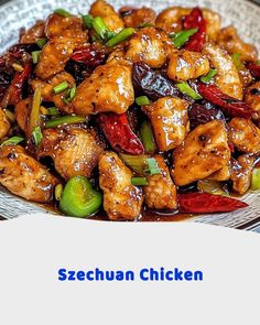 a white plate topped with chicken and peppers next to a blue sign that says sezechuan chicken