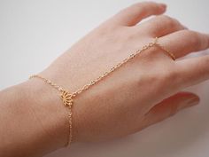 This Original Hand Jewelry is perfect for bridesmaid, wedding,... This Hand Bracelet is made with Gold plated differents chain, and Gold plated Lotus Flower.  ➵ Perfect to wear alone or for layering with more bracelets.➵ The bracelet length is ajustable thanks to 5 cm (2 in) extender chain.--*--*--*--*--*--*--*--*--*--*--*--*--*--*--*--*--*--*--∞ SIZE ∞- Bracelet length: Adjustable bracelet - around 15 cm (5.9 in) - 20 cm (7.9 in).If you like another length please make a note when you "check out Gold Bracelet Jewelry For Wedding, Gold Wedding Bracelet Jewelry, Adjustable Simple Bangle Jewelry, Gold Round Chain Bracelet For Wedding, Wedding Bracelets With Adjustable Chain, Gold Chain Wedding Bracelet, Dainty Bangle Jewelry For Bridesmaid Gift, Dainty Bangle For Bridesmaid Gift, Adjustable Bangle Jewelry For Wedding