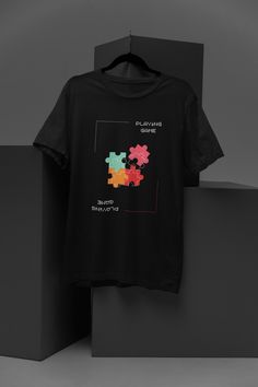 Unleash your inner gamer with our Retro Puzzle Piece T-Shirt, featuring a unique and eye-catching design that seamlessly blends vintage gaming elements with a classic puzzle motif. This unisex casual tee is perfect for gaming enthusiasts and puzzle lovers alike, offering a comfortable and stylish addition to your wardrobe. Made from high-quality, soft fabric, this t-shirt is designed to keep you comfortable whether you're gaming, hanging out with friends, or simply enjoying a day out. Available Gaming Event Crew Neck T-shirt With Letter Print, Graphic Print Crew Neck T-shirt For Gaming Events, Black Gamer T-shirt With Letter Print, Black Gamer T-shirt With Graphic Print, Graphic Print T-shirt For Gaming Events, Black Gamer Top With Screen Print, Black Short Sleeve Gamer T-shirt, Graphic Print Short Sleeve Tops For Gaming Events, Gamer T-shirt For Fan Merchandise With Short Sleeves