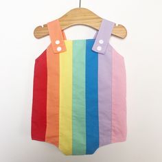 Baby retro rainbow romper. Poppers for easy changing, relaxed fit, plenty of room for nappies (cloth or disposable). Fully lined with light soft cotton. Seamless insides making them comfortable against babies skin. Rainbow design made up of carefully selected colours of 100% premium quality cotton. Adjustable length straps. Spring Multicolor Cotton Onesie, Playful Cotton Jumpsuits And Rompers For Playtime, Fun Cotton Bubble Romper For Playtime, Multicolor Bubble Romper For Summer Playtime, Multicolor Cotton Bubble Romper For Playtime, Multicolor Jumpsuits And Rompers For Summer Playwear, Multicolor Cotton Overalls For Summer, Playful Cotton Bubble Romper For Playtime, Playful Multicolor Bubble Romper For Playtime