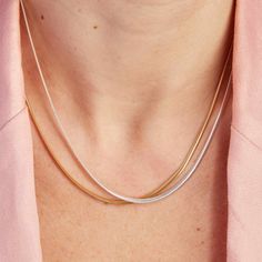 Embrace the elegance of our Snake Chain Necklace, a staple piece to add sophistication to every look. Perfect for wearing alone or for layering alongside your favourite Merci Maman personalized necklaces, this chain is a timeless way to elevate your everyday jewelry collection.&nbsp;18K Champagne Gold Plated or 925 Sterling SilverLength: 0.4Width: 0.09Thickness: 0.05Sent with love in a complimentary gift box Timeless Delicate Chain Necklace In Rose Gold, Classic Rose Gold Chain Necklace With Delicate Chain, Classic Rose Gold Delicate Chain Necklace, Classic Delicate Rose Gold Chain Necklace, Classic Chain Necklace For Layering, Elegant White Gold Snake Chain Necklaces, Elegant Rose Gold Chain Necklace For Layering, Elegant White Gold Chain Necklace For Layering, Elegant Everyday Necklace With Snake Chain