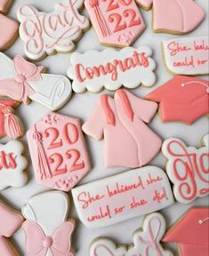 decorated cookies with pink and white icing for graduation