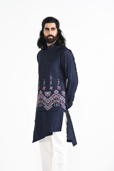 Navy Phulkari inspired Nehru Jacket with pipe, cutdaana and thread work embroidery with overlapping kurta highlighted with embroidery detail on the chest and stitchline border made in Bamberg Raw Silk. Paired with Ivory slim fit Pant Pajama. Color of the actual garment may vary due to lighting conditions during the shoot.
 

Size Chart For Men





	
	
					Men's Size Chart
		

		
		
						
				Size Chart For Men
				Custom Size Measurement Guide
			
			
				
				
				Custom Size Measurement Gui Designer Floral Embroidery Kurta For Transitional Season, Designer Floral Embroidered Kurta For Transitional Season, Chanderi Bandhgala With Intricate Embroidery, Bandhgala With Intricate Embroidery For Traditional Ceremonies, Intricate Embroidered Bandhgala For Traditional Ceremonies, Traditional Drape Kurta With Floral Embroidery For Eid, Transitional Straight Kurta Bandhgala With Intricate Embroidery, Straight Kurta Bandhgala With Floral Embroidery For Eid, Floral Embroidered Kurta With Traditional Drape For Eid