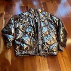 Brown Metallic Quilted Puffer Jacket With Elastic Bottom Hem, Front Zip Closure, Dual Front Buttoned Pockets And Metallic Threaded Elastic Cuffs. Coat Is Brand New With Tags Size 4. Metallic Outerwear With Pockets For Fall, Trendy Metallic Outerwear For Fall, Casual Metallic Outerwear For Fall, Trendy H&m Winter Outerwear, H&m Outerwear For Cold Weather And Winter, H&m Outerwear For Cold Weather In Fall, H&m Winter Outerwear For Cold Weather, Metallic Long Sleeve Winter Outerwear, Dark Brown Puffer Jacket