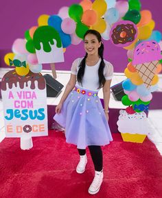 a girl standing in front of an ice cream display